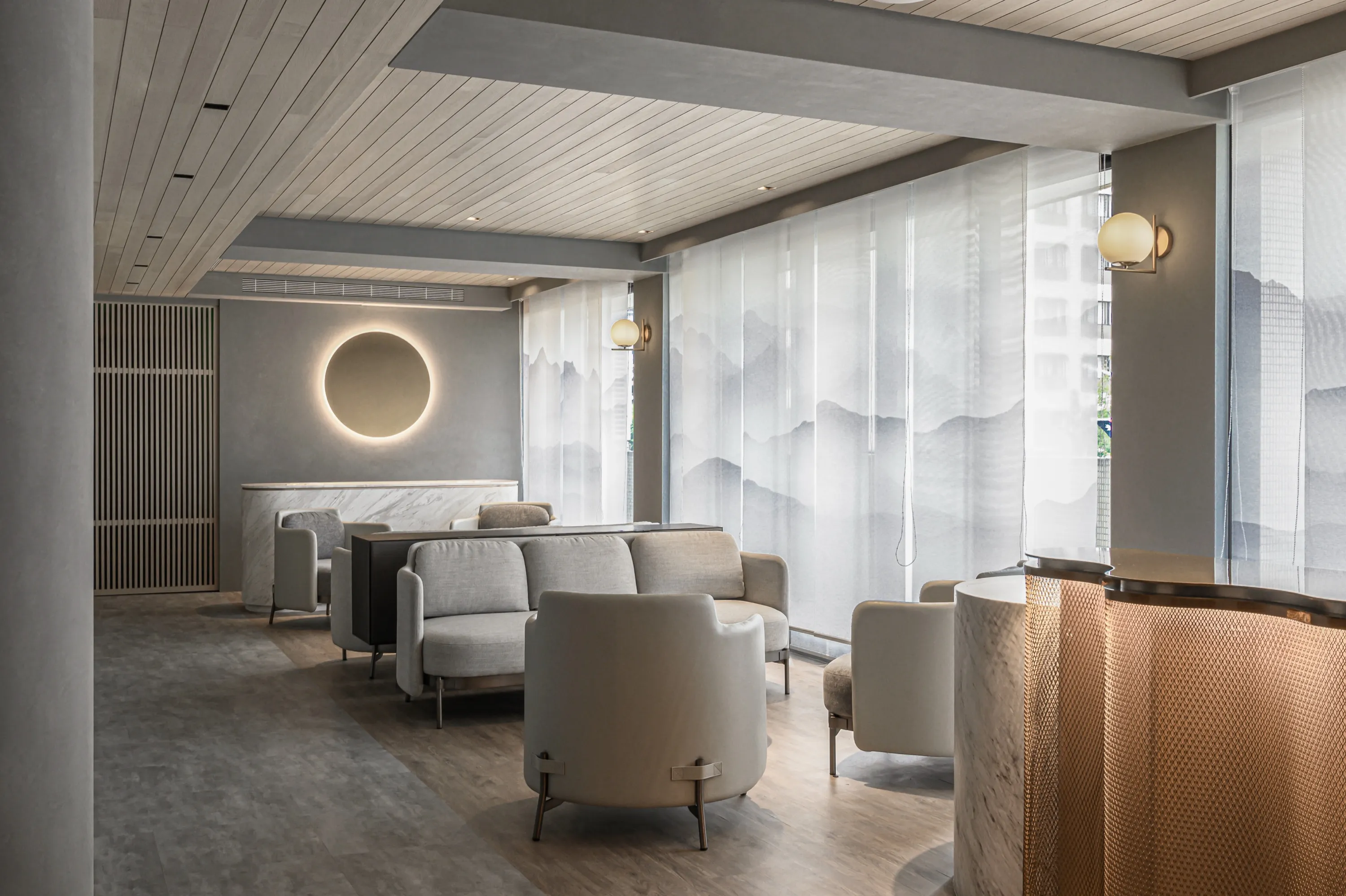 A calm, light-filled lounge designed to ease the transition into treatment.